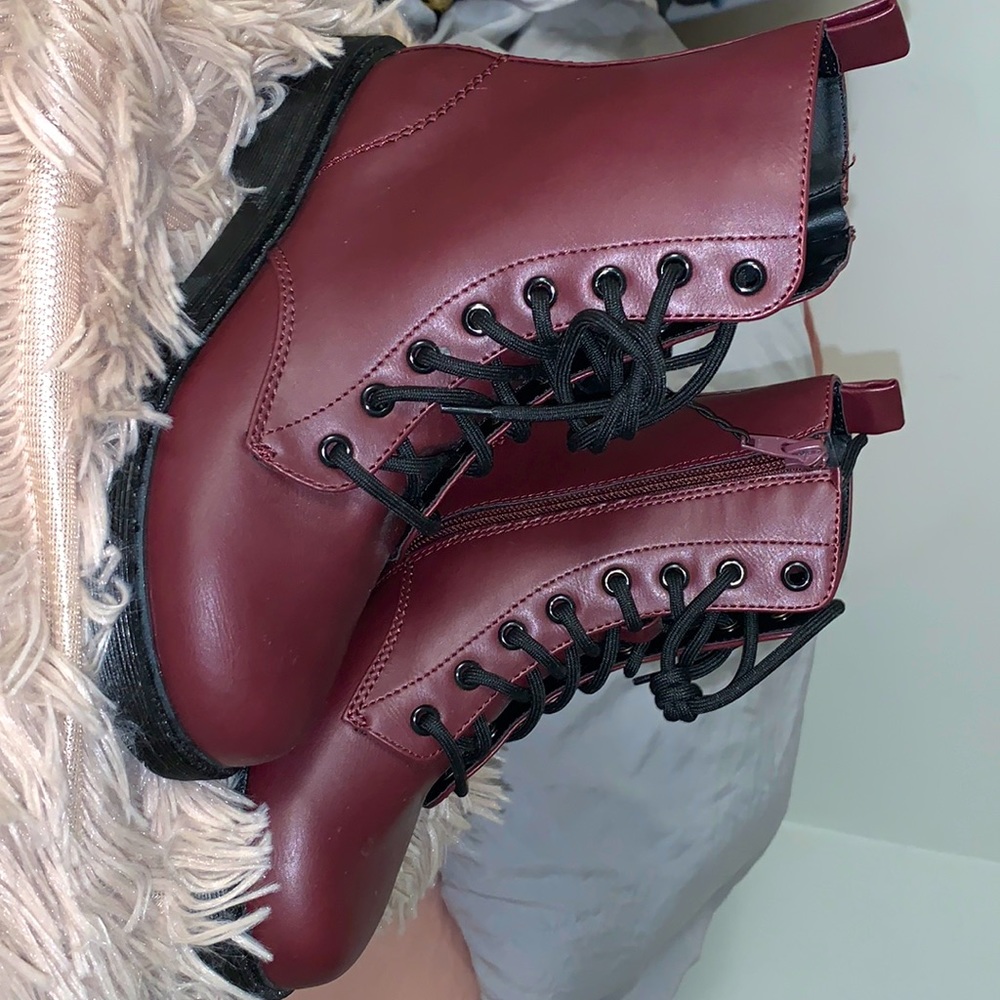 Burgundy combat boots.